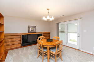 Dining area with an inviting chandelier