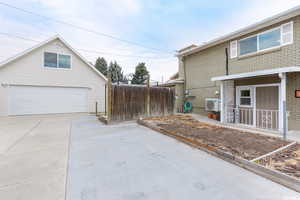 View of side of property featuring covered porch