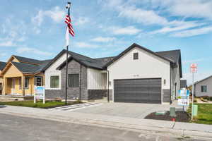 Modern farmhouse style home with a garage