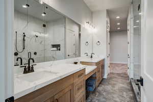 Bathroom featuring vanity and walk in shower