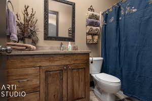 Bathroom featuring vanity and toilet