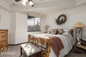 Carpeted bedroom with ceiling fan