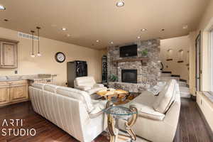 Living room with a fireplace and dark hardwood / wood-style flooring