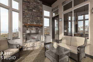 Living room with a fireplace and a healthy amount of sunlight