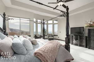 Carpeted bedroom with a mountain view and ceiling fan with notable chandelier