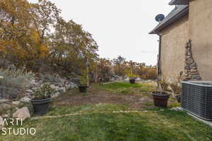 View of yard featuring central air condition unit