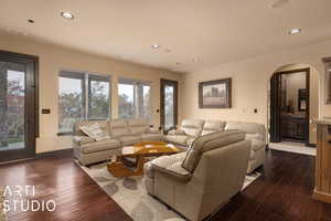 Living room with dark wood-type flooring