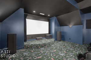 Carpeted home theater room with a textured ceiling and lofted ceiling