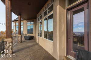 Wooden deck featuring covered porch