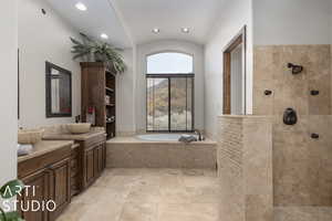 Bathroom with vanity and shower with separate bathtub