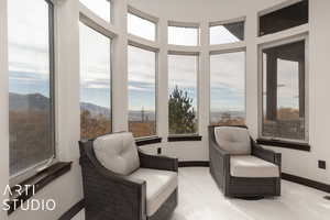 Sunroom / solarium with a mountain view