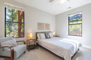 Bedroom featuring ceiling fan and light colored carpet