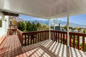 Covered wood deck off kitchen and family room.