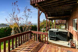 Backyard,  deck and hot tub.