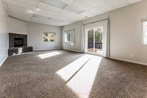 Great room with fireplace and walk out to back patio.