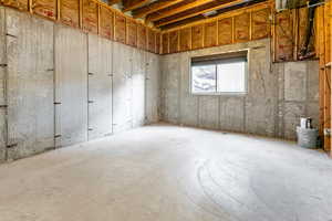 Unfinished bedroom in basement.