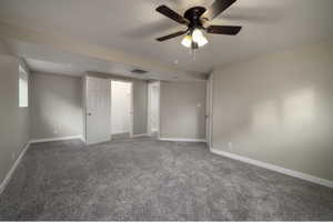 Unfurnished bedroom with carpet and ceiling fan