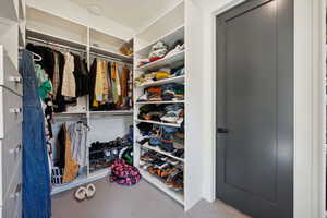 Walk in closet with shelving