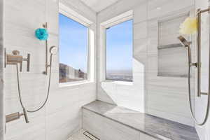 Bathroom featuring tiled shower