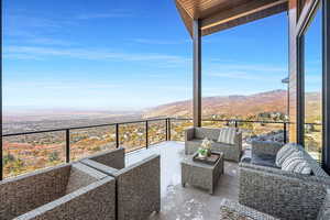 View of patio featuring outdoor lounge area, and balcony views