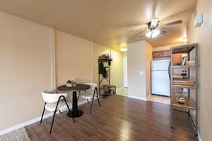 Dining area featuring hardwood / wood-style flooring and ceiling fan