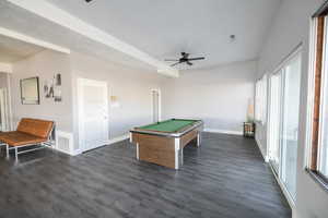 Playroom featuring a textured ceiling, ceiling fan, dark hardwood / wood-style floors, and pool table