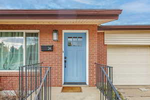 Property entrance with a garage