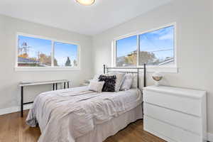 Bedroom featuring dark wood-type flooring