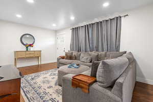 Living room featuring dark hardwood / wood-style flooring