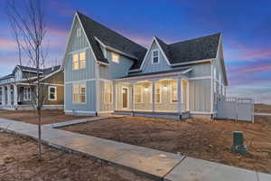 View of front of home featuring covered porch