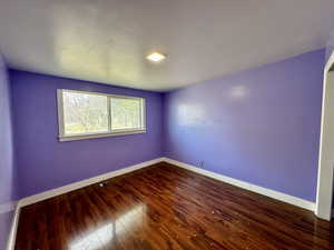 Empty room featuring hardwood / wood-style floors