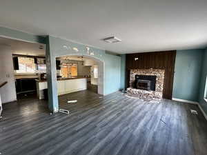 Unfurnished living room with dark hardwood / wood-style flooring