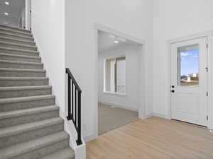 Entryway with light hardwood / wood-style flooring