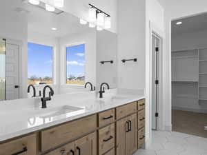 Bathroom with vanity and tile patterned floors