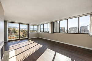 Unfurnished sunroom with a mountain view