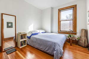 Bedroom featuring wood-type flooring