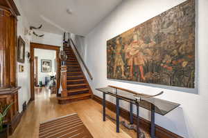 Stairway with hardwood / wood-style flooring