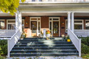 Entrance to property featuring a porch