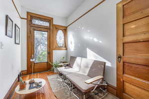 Sitting room with light hardwood / wood-style floors