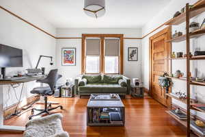 Home office featuring hardwood / wood-style floors