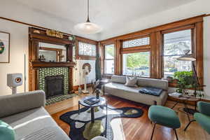 Living room featuring a fireplace and wood-type flooring