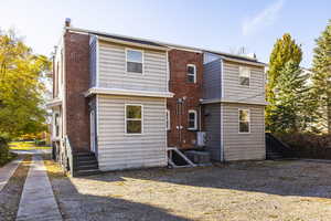 Back of house featuring central AC