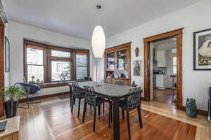 Dining area with hardwood / wood-style floors