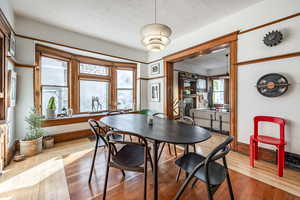 Dining room featuring a textured ceiling and light wood-type flooring