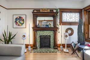 Living area with a tile fireplace