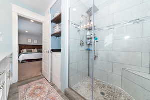 Bathroom featuring hardwood / wood-style floors and walk in shower