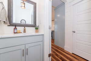 Bathroom featuring hardwood / wood-style floors and vanity