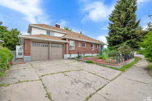 View of front facade featuring a garage