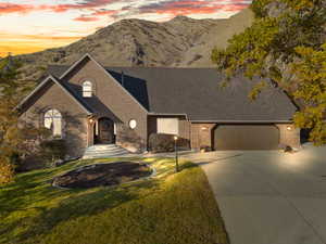 View of front of property featuring a mountain view and a yard