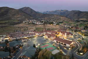 Aerial view at dusk featuring a mountain view